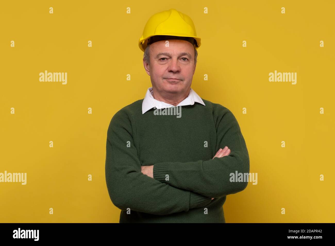 Senior caucasian foreman with special hard hat Stock Photo