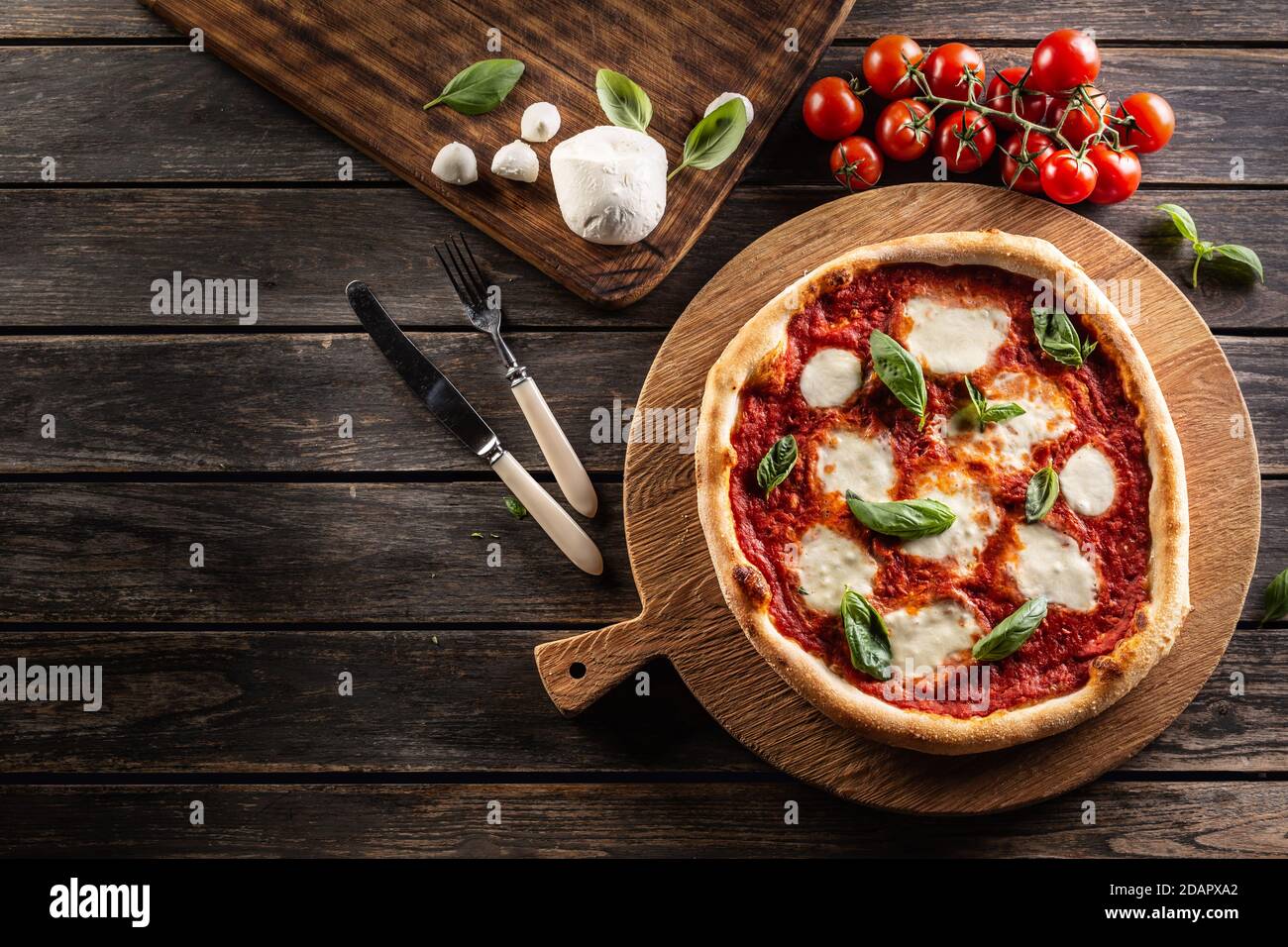 Pizza Napoletana - Napoli tomato sauce mozzarella and basil - top of view. Stock Photo