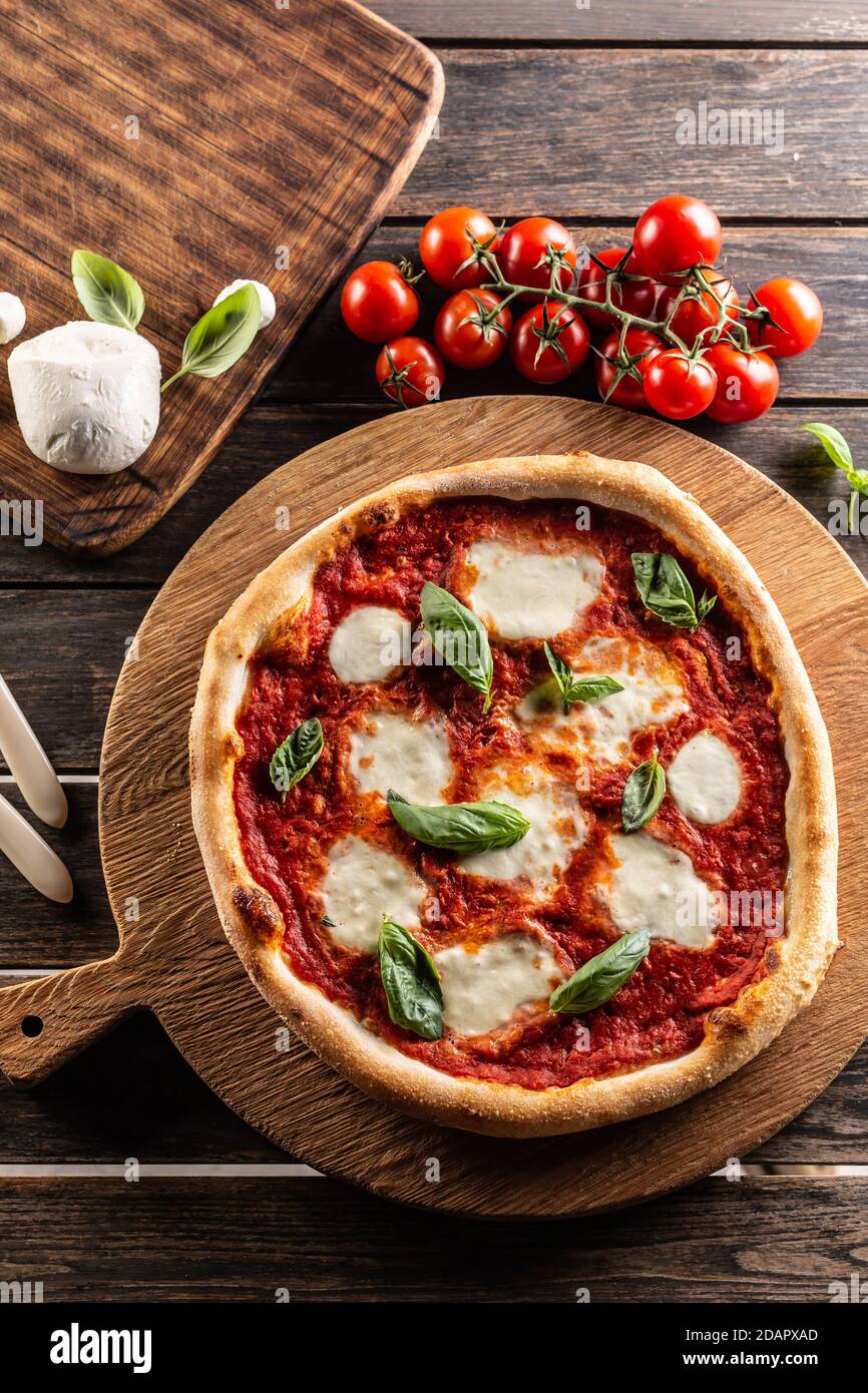 Pizza Napoletana - Napoli tomato sauce mozzarella and basil - top of view. Stock Photo