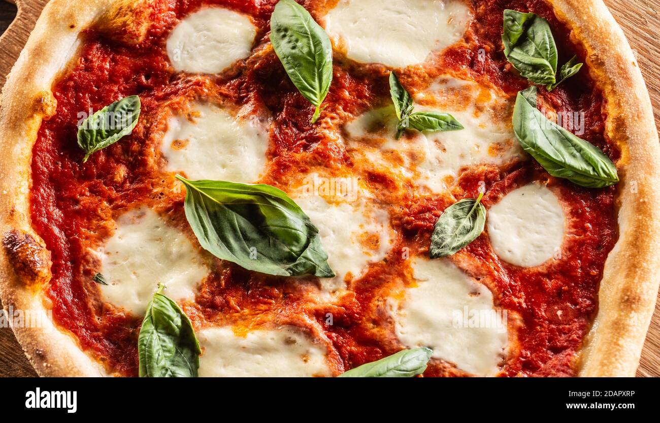 Pizza Napoletana - Napoli tomato sauce mozzarella and basil. Stock Photo