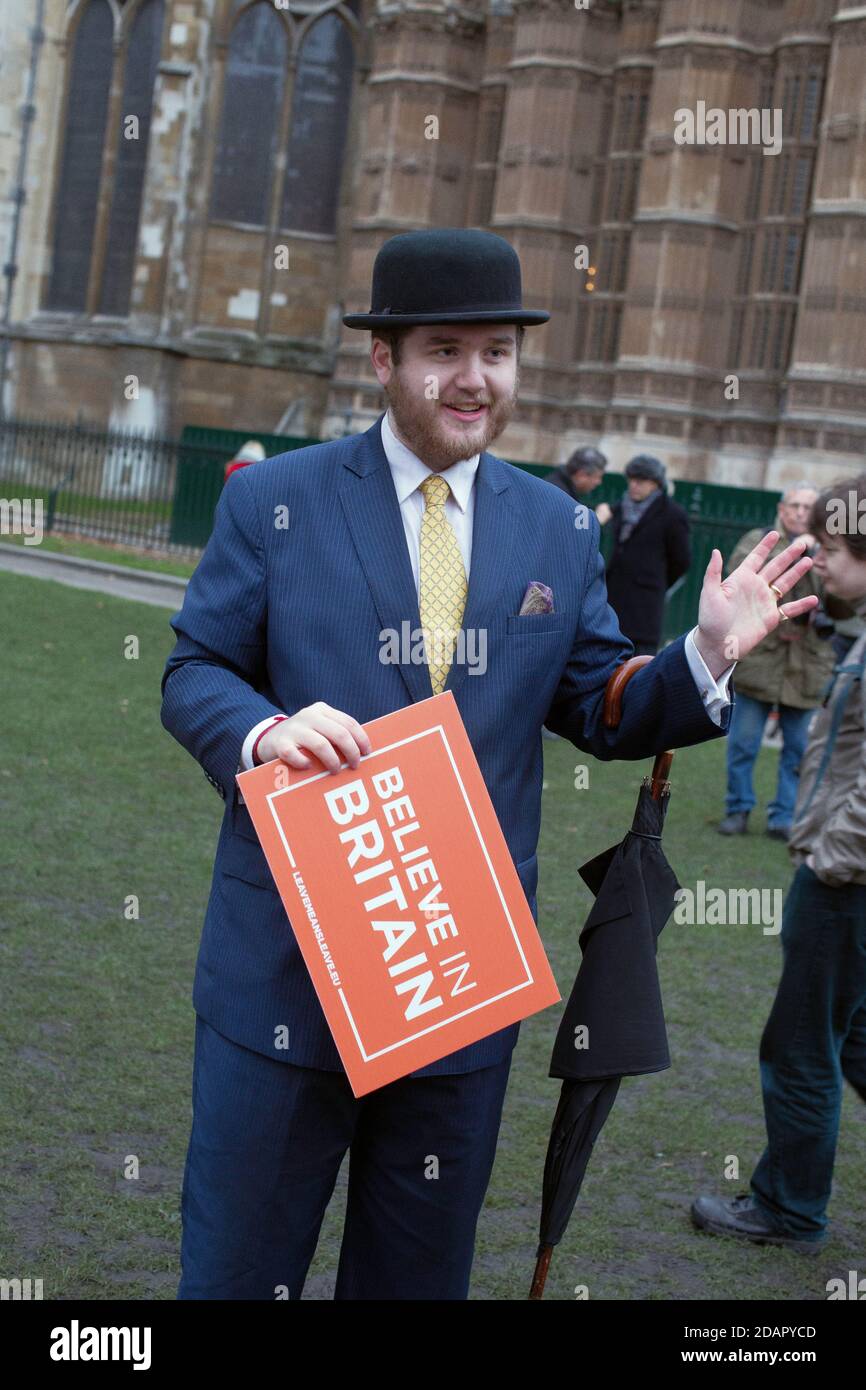 GREAT BRITAIN / England / London / Morrris  from Oxford an Englishman with bowler hat holds a placard reading  “Believe in Britain” outside the Houses Stock Photo