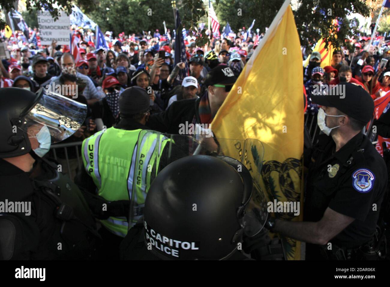 Washington Dc, USA. 14th Nov, 2020. (NEW) Trump and Biden Supporters clash at the Supreme Court in Washington DC. November 14, 2020, Washington DC, Maryland, USA: Trump and Biden supporters clash at the Supreme Court in Washington DC during a TrumpÃ¢â‚¬â„¢s MAGA Million March to show their support for Trump and protest against the Presidential election result which they claim to be fraudulent. There were some Police Officers to provide security between them .Credit : Niyi Fote /Thenews2. Credit: Niyi Fote/TheNEWS2/ZUMA Wire/Alamy Live News Stock Photo