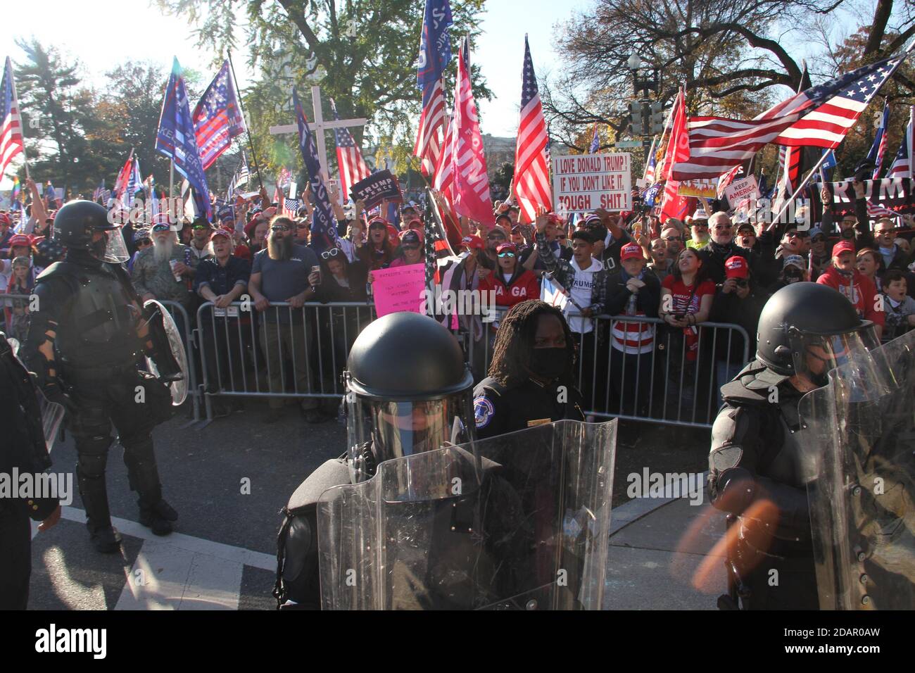 Washington Dc, USA. 14th Nov, 2020. (NEW) Trump and Biden Supporters clash at the Supreme Court in Washington DC. November 14, 2020, Washington DC, Maryland, USA: Trump and Biden supporters clash at the Supreme Court in Washington DC during a TrumpÃ¢â‚¬â„¢s MAGA Million March to show their support for Trump and protest against the Presidential election result which they claim to be fraudulent. There were some Police Officers to provide security between them .Credit : Niyi Fote /Thenews2. Credit: Niyi Fote/TheNEWS2/ZUMA Wire/Alamy Live News Stock Photo