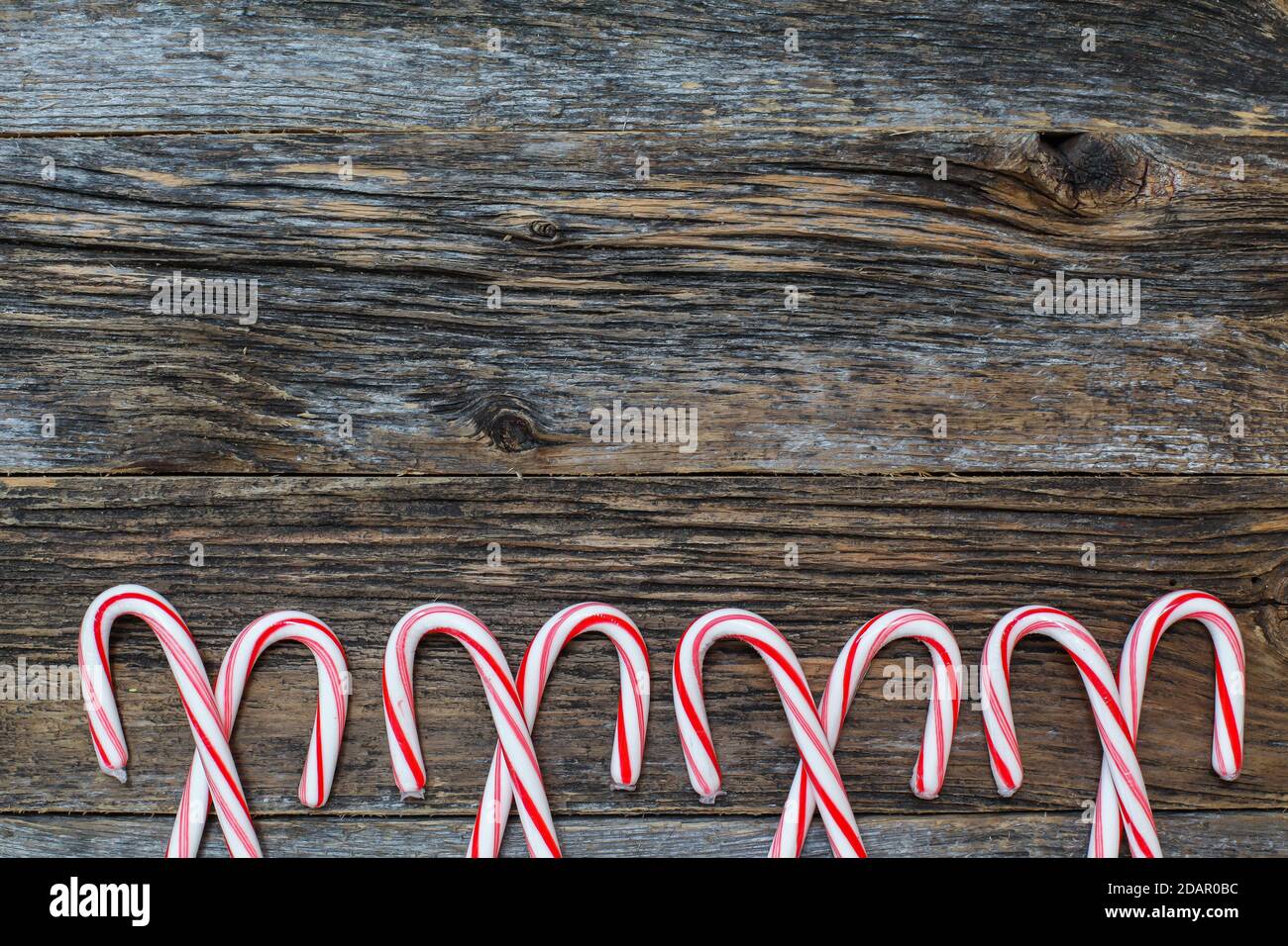 Rustic wood with candy canes Stock Photo Alamy