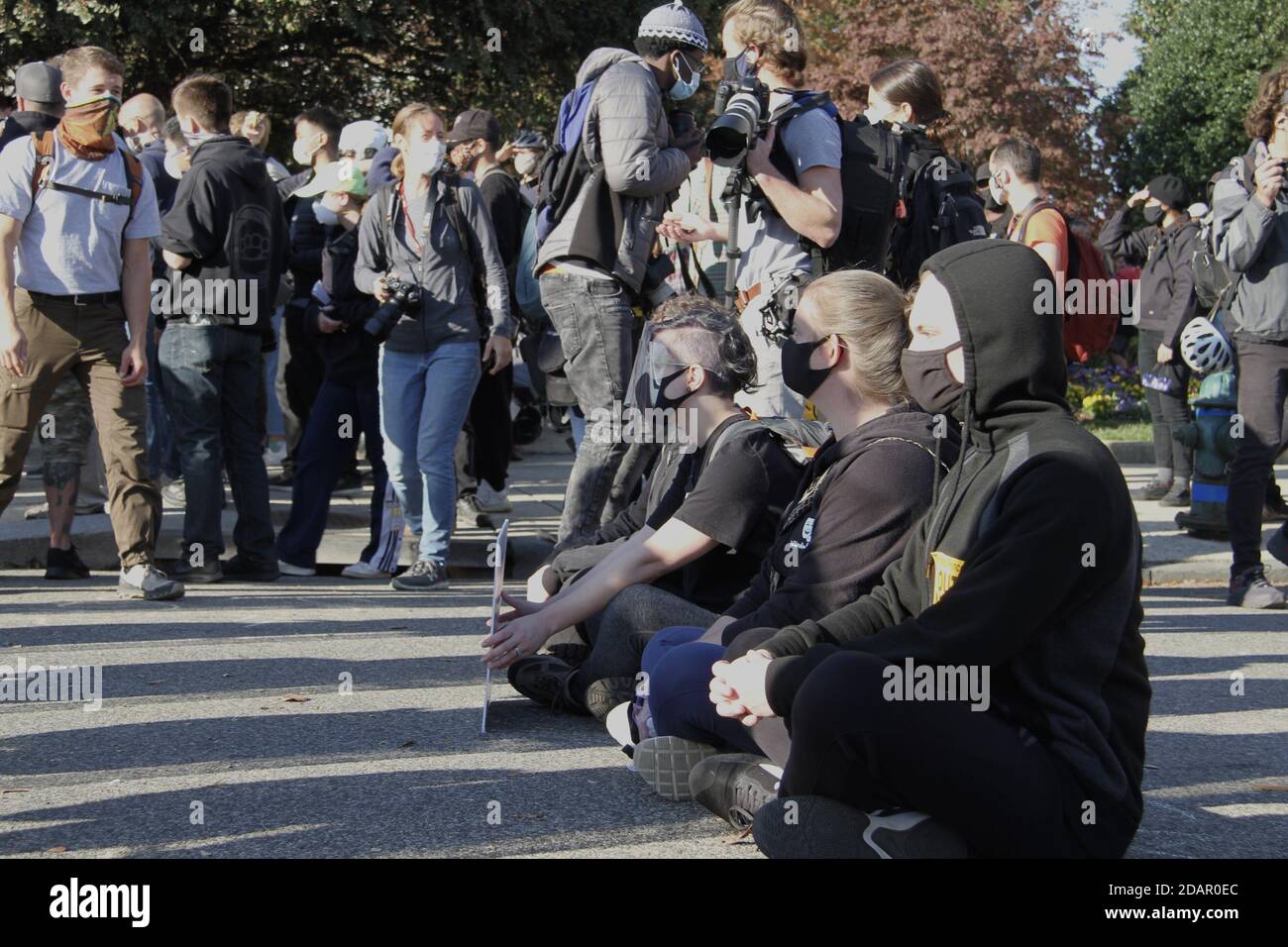 Washington Dc, USA. 14th Nov, 2020. (NEW) Trump and Biden Supporters clash at the Supreme Court in Washington DC. November 14, 2020, Washington DC, Maryland, USA: Trump and Biden supporters clash at the Supreme Court in Washington DC during a TrumpÃ¢â‚¬â„¢s MAGA Million March to show their support for Trump and protest against the Presidential election result which they claim to be fraudulent. There were some Police Officers to provide security between them .Credit : Niyi Fote /Thenews2. Credit: Niyi Fote/TheNEWS2/ZUMA Wire/Alamy Live News Stock Photo