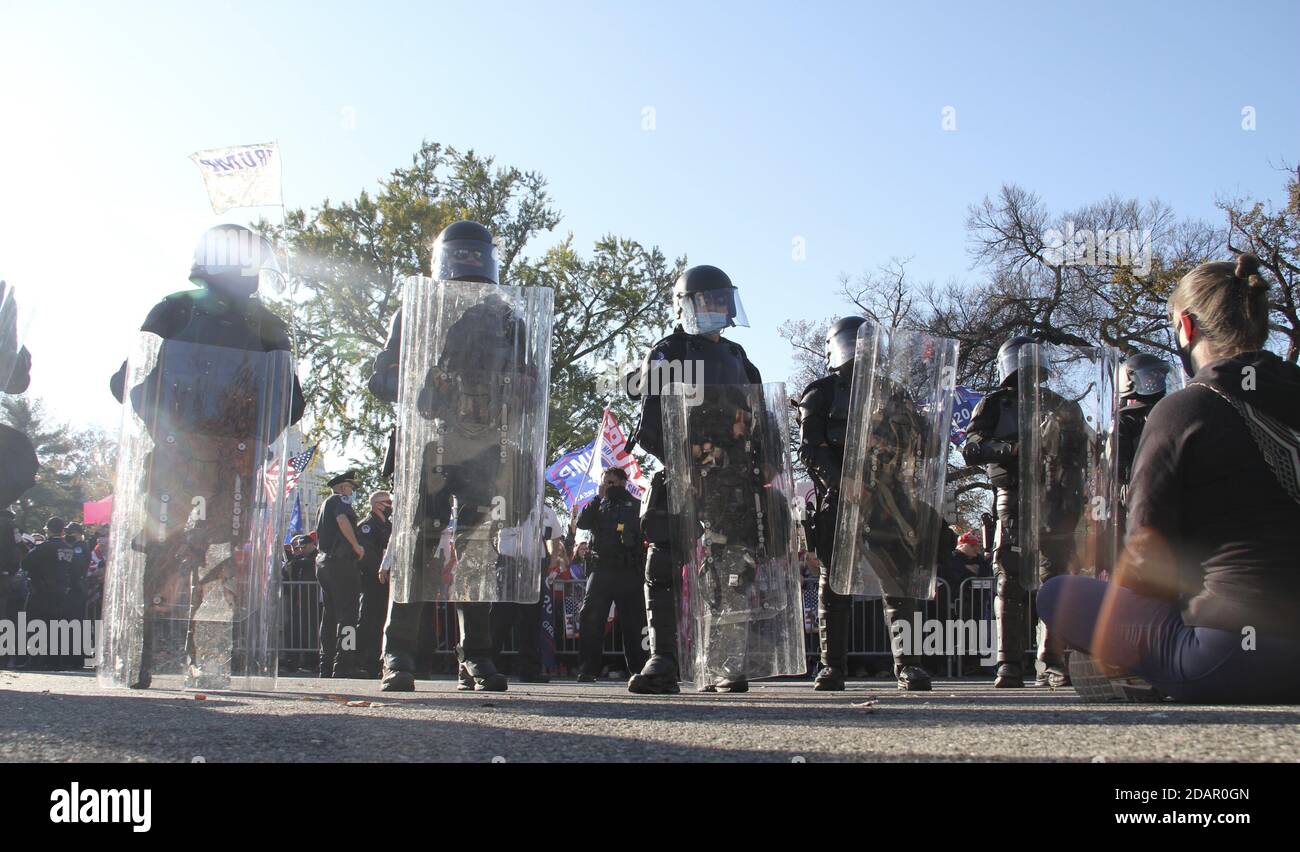 Washington Dc, USA. 14th Nov, 2020. (NEW) Trump and Biden Supporters clash at the Supreme Court in Washington DC. November 14, 2020, Washington DC, Maryland, USA: Trump and Biden supporters clash at the Supreme Court in Washington DC during a TrumpÃ¢â‚¬â„¢s MAGA Million March to show their support for Trump and protest against the Presidential election result which they claim to be fraudulent. There were some Police Officers to provide security between them .Credit : Niyi Fote /Thenews2. Credit: Niyi Fote/TheNEWS2/ZUMA Wire/Alamy Live News Stock Photo