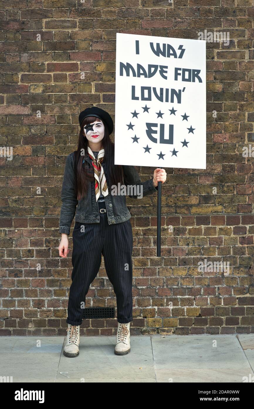 LONDON, UK - A young anti-brexit protester holds a 'I was made for loving EU 'placard during Anti Brexit protest on March 23, 2019 in London. Stock Photo