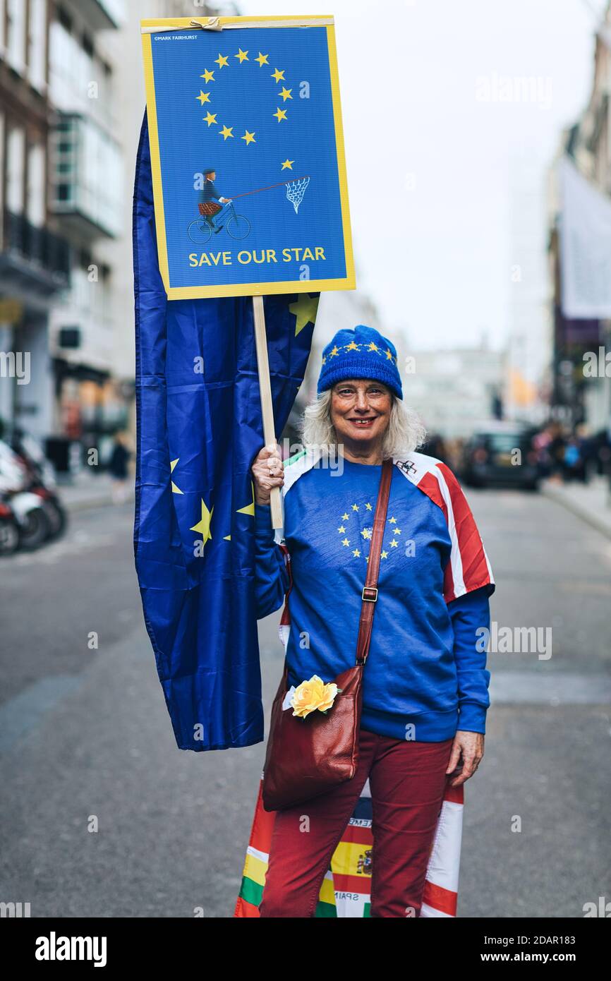 LONDON, UK - A anti-brexit protester holds a 'save our star 'placard during Anti Brexit protest on March 23, 2019 in London. Stock Photo
