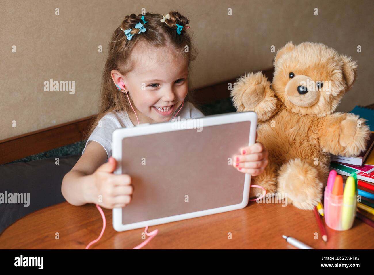 Schoolgirl studying math during her online lesson at home, Self ...