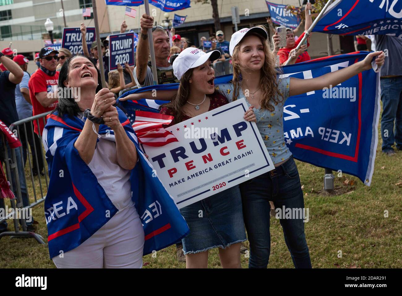 Fort Worth, Texas, USA. 14th Nov, 2020. 11/14/20 Fort Worth, Texas - Three women from Wichita Falls smile and chant while a massive crowd of Trump Supporters protests the 2020 Presidential Election in Fort Worth, Texas. Credit: Chris Rusanowsky/ZUMA Wire/Alamy Live News Stock Photo