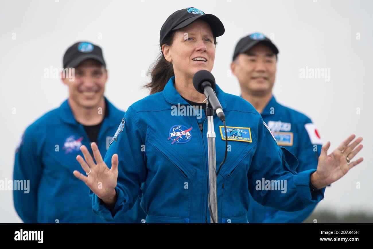 NASA astronaut Shannon Walker speaks to the media after arriving at the Launch and Landing Facility for the Commercial Crew One mission at the Kennedy Space Center November 8, 2020 in Cape Canaveral, Florida. Standing behind Walker are: NASA astronaut Mike Hopkins and JAXA astronaut Soichi Noguchi, right. Stock Photo
