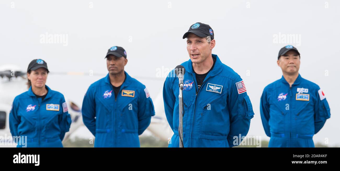NASA astronaut Mike Hopkins speaks to the media after arriving at the Launch and Landing Facility for the Commercial Crew One mission at the Kennedy Space Center November 8, 2020 in Cape Canaveral, Florida. Standing behind Hopkins are: NASA astronaut Shannon Walker, Victor Glover and JAXA astronaut Soichi Noguchi, right. Stock Photo