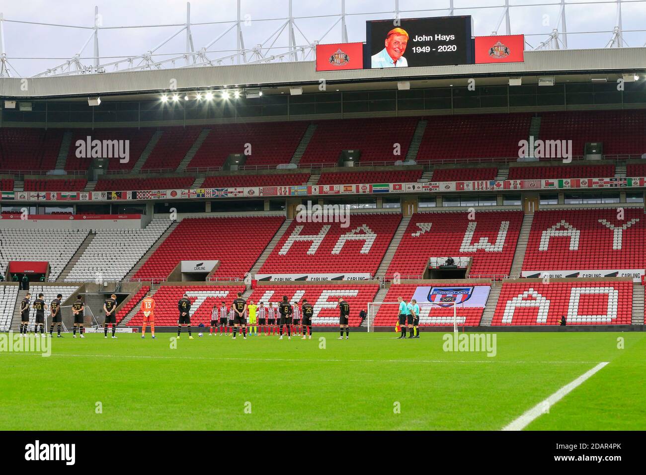 Sunderland and Milton Keynes Dons players observe a minute's silence