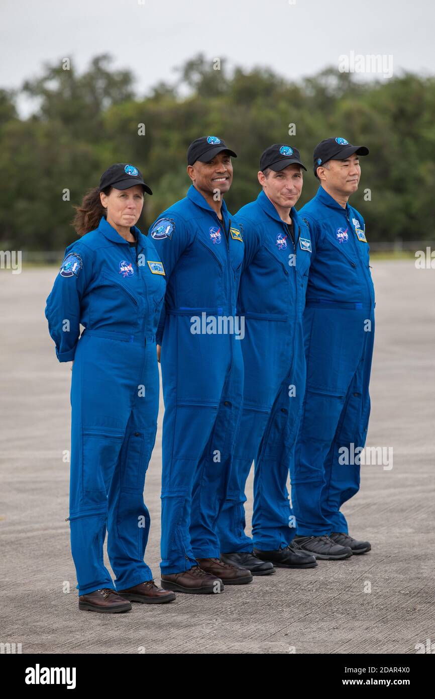 NASA astronauts stand together after arriving at the Launch and Landing Facility for the Commercial Crew One mission at the Kennedy Space Center November 8, 2020 in Cape Canaveral, Florida. Standing from left to right are: NASA astronaut Shannon Walker, Victor Glover, Mike Hopkins, and JAXA astronaut Soichi Noguchi. Stock Photo