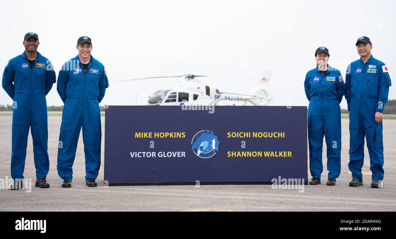 NASA astronauts and pose at the Launch and Landing Facility for the Commercial Crew One mission after arriving at the Kennedy Space Center November 8, 2020 in Cape Canaveral, Florida. Standing from left to right are: NASA astronaut Victor Glover, Mike Hopkins, Shannon Walker, and JAXA astronaut Soichi Noguchi. Stock Photo