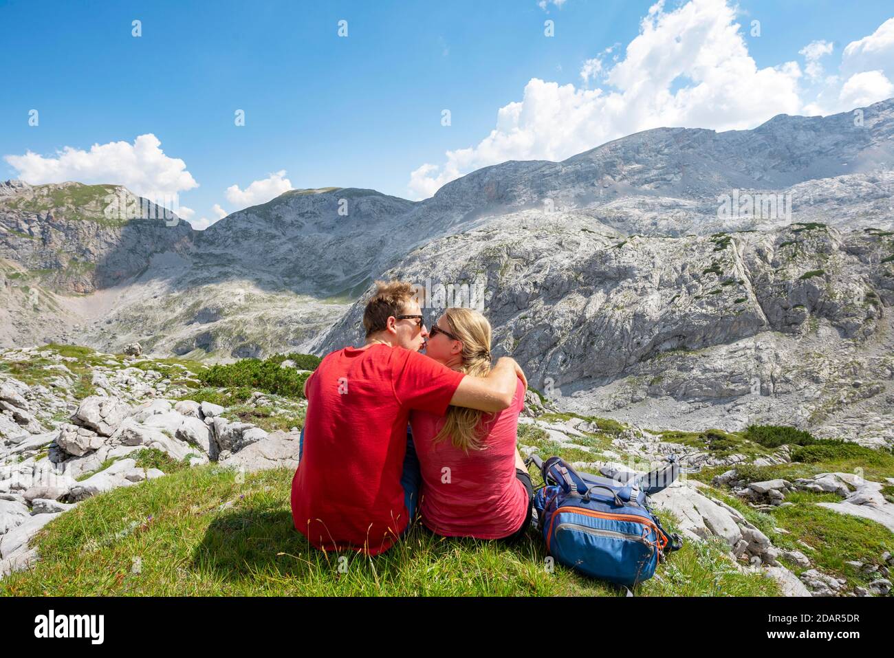 Couples hiking, young man and young woman kissing, Steinernes Meer, Berchtesgaden National Park, Berchtesgadener Land, Upper Bavaria, Bavaria, Germany Stock Photo