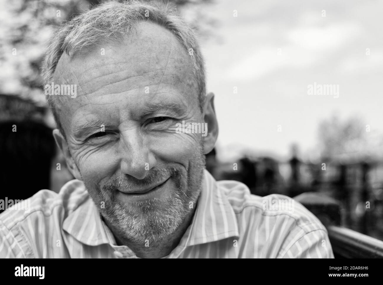 Portrait of a happy middle aged man with stubble Stock Photo