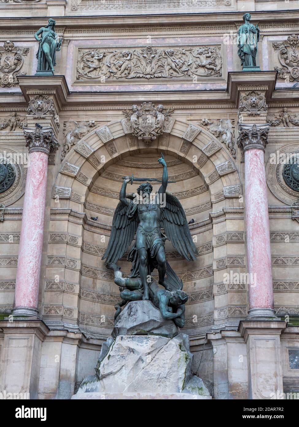 Bronze statue of the fountain La Fontaine Saint Michel at Place Saint