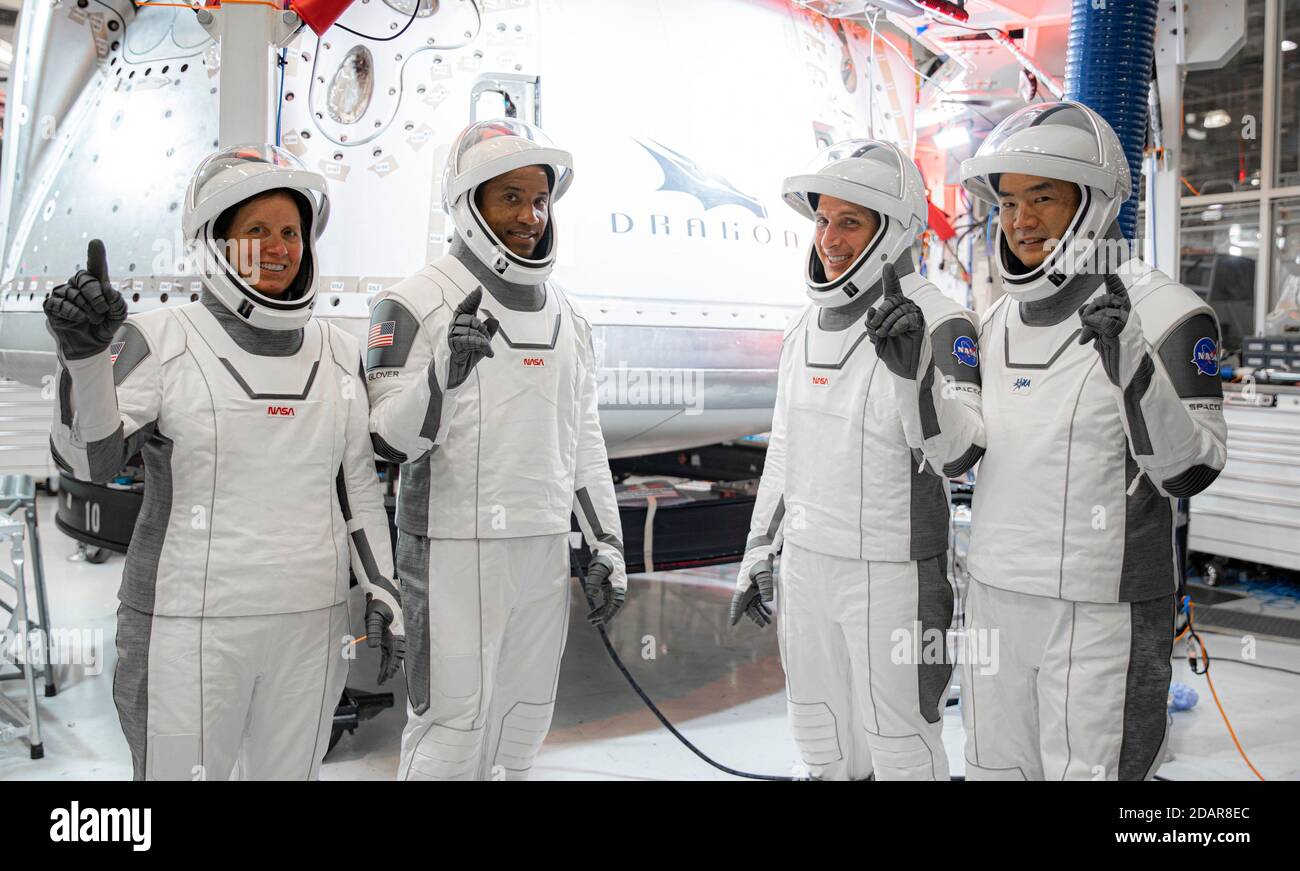 Astronauts for the NASA SpaceX Crew-1 missionpose together during the ...