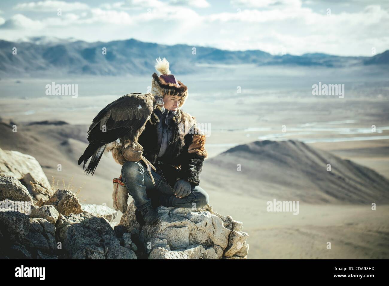 Eagle hunter Tileichan, son of Bashakhan Spai, hunting in the Kisil Czar, Olgii, Mongolia Stock Photo