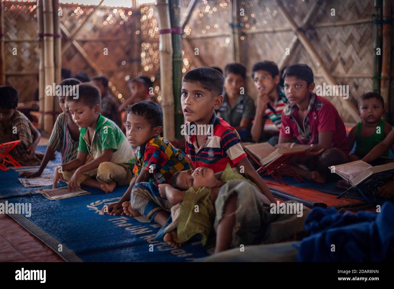 Children in a madrasah, Koran school, camp for Rohingya refugees from Myanmar, Kutupalong, Cox Bazar, Bangladesh Stock Photo