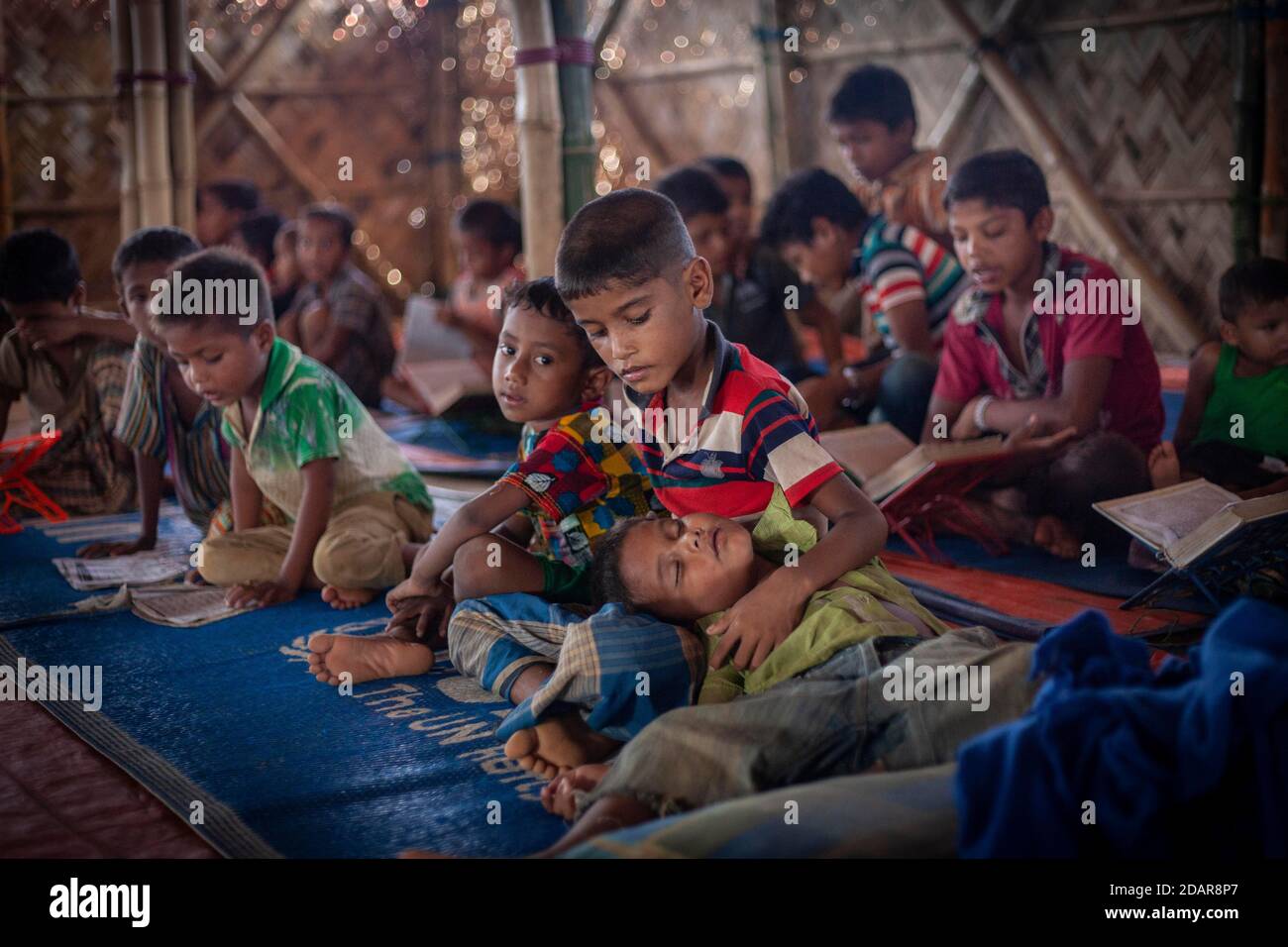 Children in a madrasah, Koran school, camp for Rohingya refugees from Myanmar, Kutupalong, Cox Bazar, Bangladesh Stock Photo