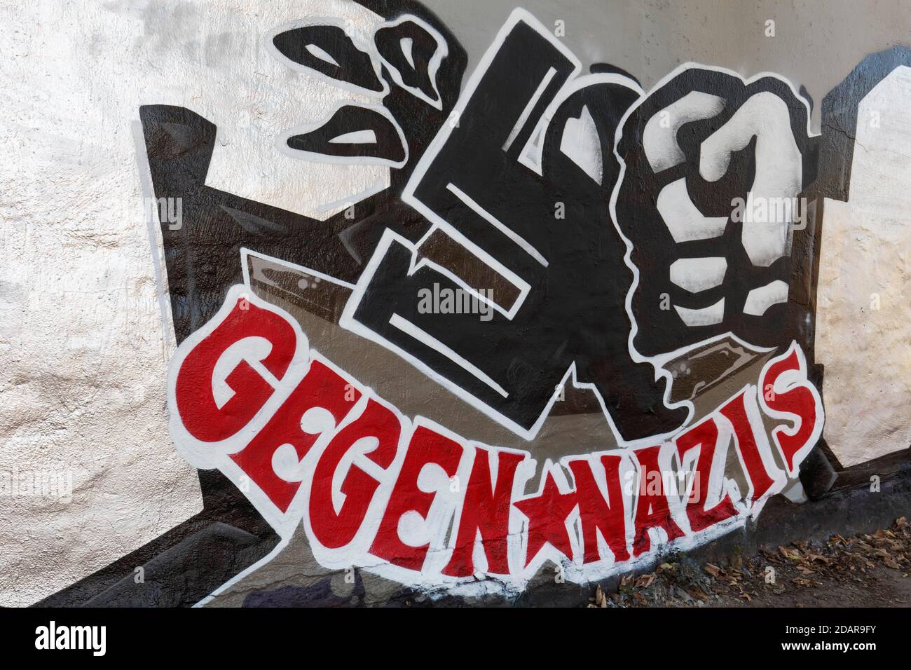 Faust smashes swastika, graffito against Nazis, Duesseldorf, North Rhine-Westphalia, Germany Stock Photo