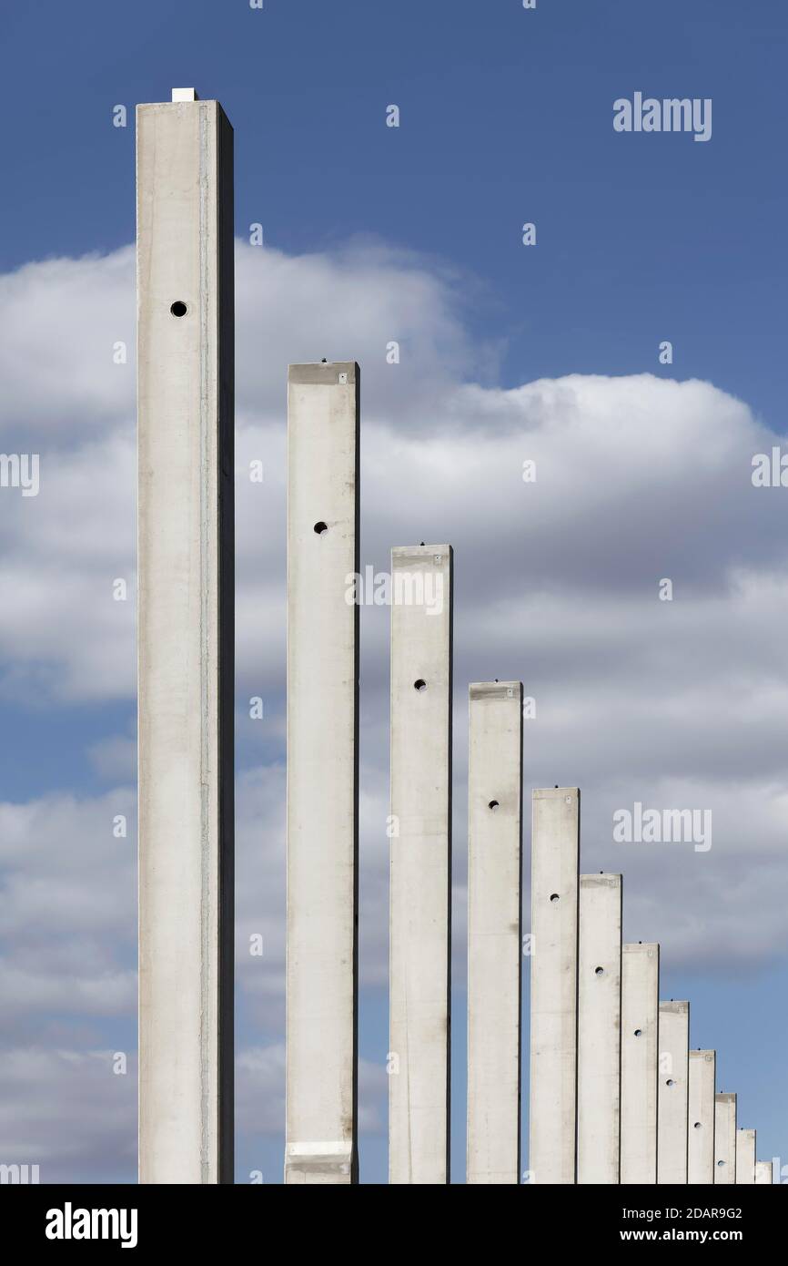 Concrete columns in a row, in front of a blue sky, carcass logistics hall, Duisburg, North Rhine-Westphalia, Germany Stock Photo