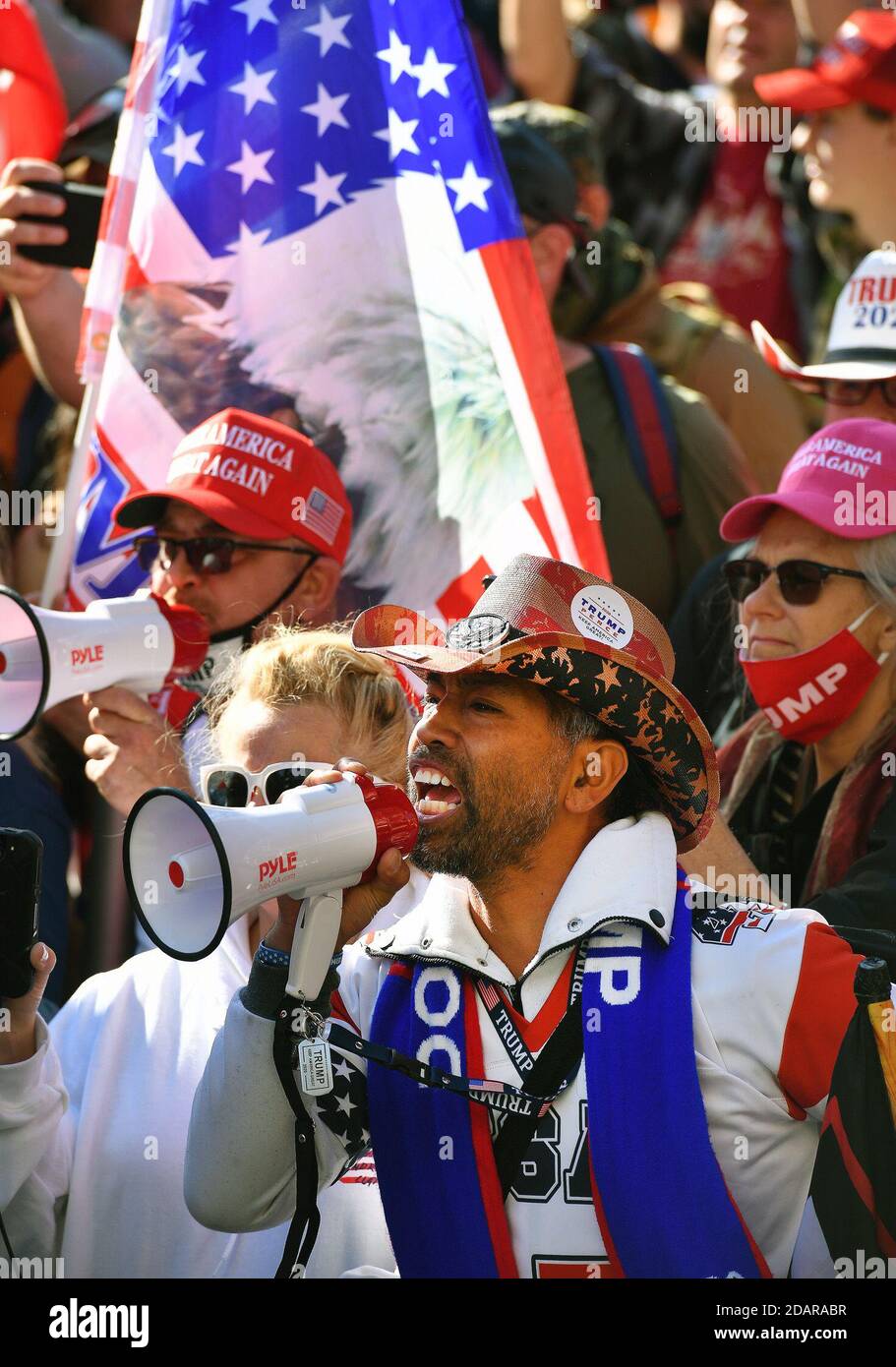 Washington, District of Columbia, USA. 14th Nov, 2020. Washington, DC - 111420 Angry Trump supporters with megaphones scream at ant- Trump protesters on 14, 2020 outside of the Supreme Court Justice building during a day where tens of thousands of Trump supporters came to DC to show their support for the president. Credit: Essdras M. Suarez/ZUMA Wire/Alamy Live News Stock Photo