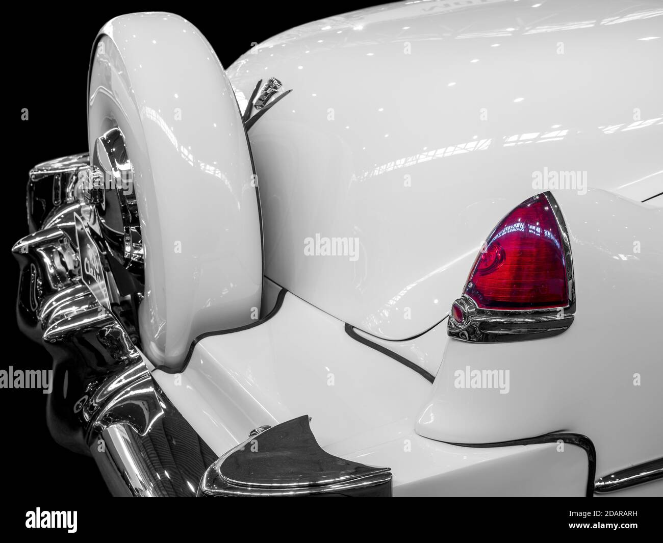 Oldtimer detail, Cadillac Series 62 1952, in black and white, with red brake light Stock Photo