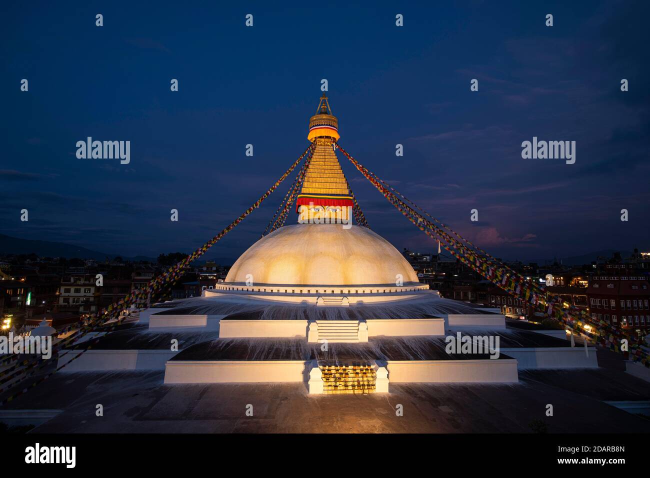 Boudha Stupa with the all-seeing eyes of Buddha in the evening light, Boudanath, also Bodnath, Buddhist sanctuary and pilgrimage site in Kathmandu Stock Photo