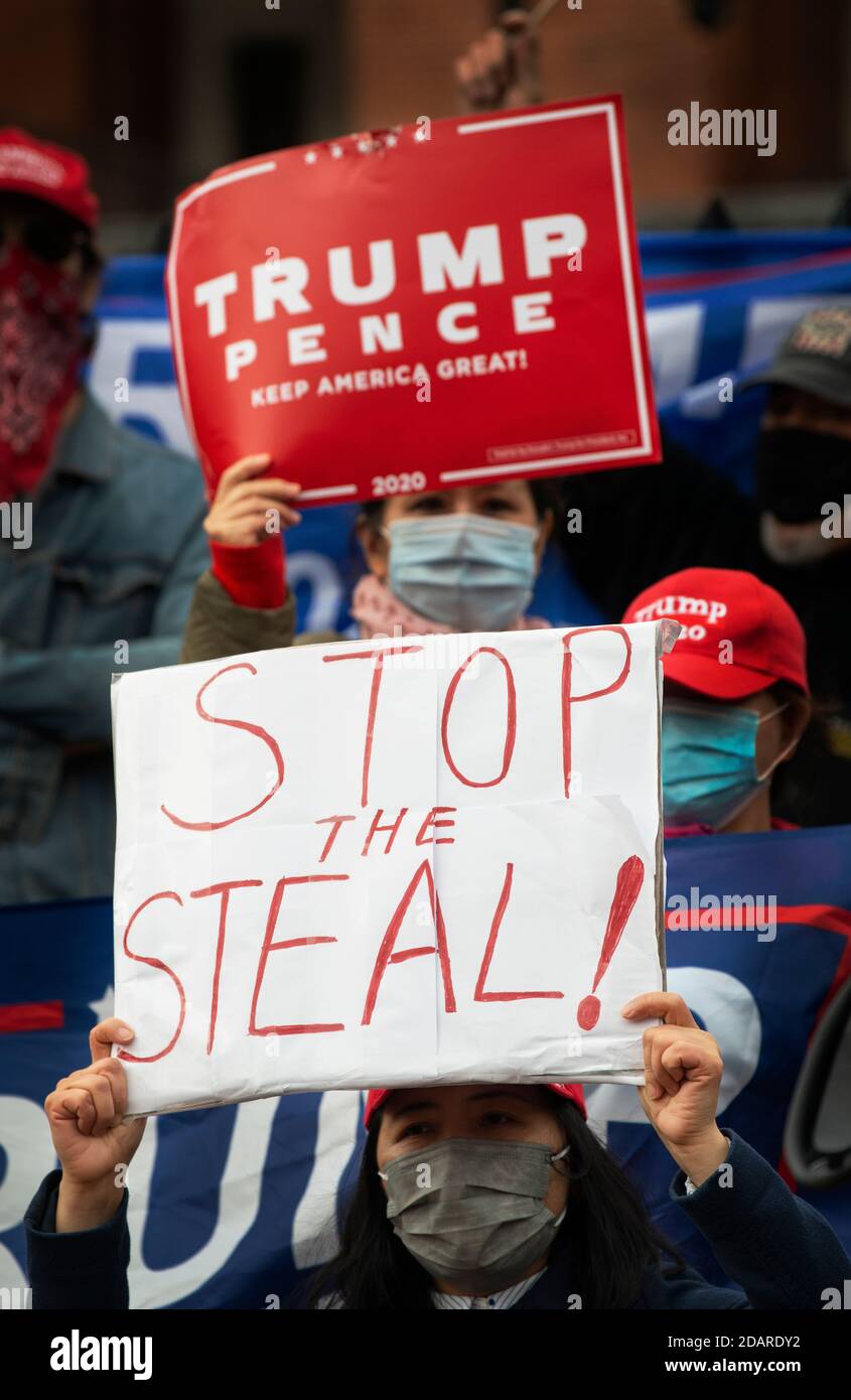 Stop The Steal. Massachusetts State House, Boston, Massachusetts, USA. 14 Nov. 2020.  A small group of supporters of current U.S. president Donald Trump gathered on the steps of the Massachusetts State House echoing Trump’s claim that the Democrats have stolen the 2020 election.  Stop The Steal demonstrations happened around the United States on Saturday. Stock Photo