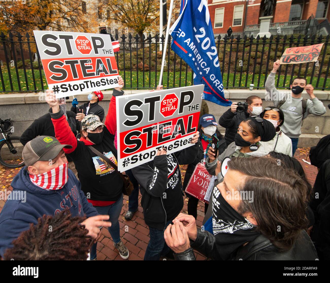Stop The Steal, Massachusetts State House, Boston, Massachusetts, USA. 14 Nov. 2020.  A small group of supporters of current U.S. president Donald Trump faced off with Anti-Trump, Refuse Fascism, demonstrators in front of the Massachusetts State House.  The Trump supporters carried signs printed with “Stop The Steal” echoing Trump’s claim that the Democrats have stolen the 2020 election.  Stop The Steal demonstrations happened around the United States on Saturday. Credit: Chuck Nacke / Alamy Live News Stock Photo