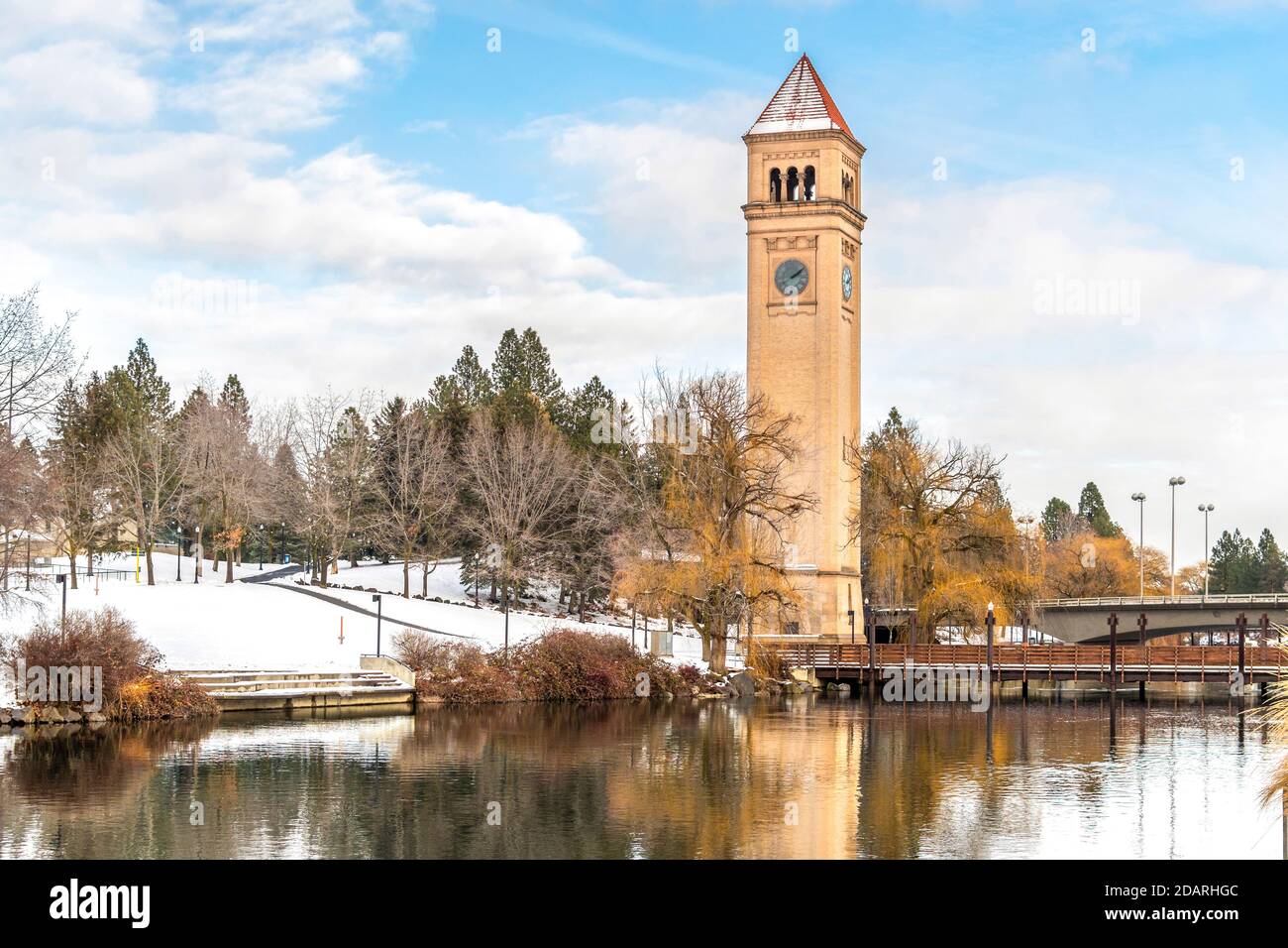 The Great Northern Clocktower, expo pavilion, and the Spokane River in Riverfront Park during an early autumn snowfall. Stock Photo
