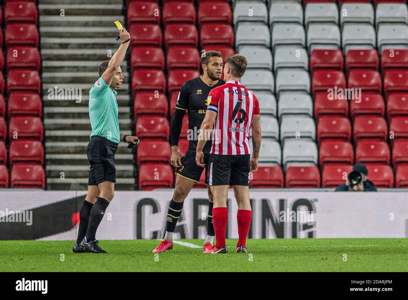 sunderland, england. november 14th carlton morris receives a yellow card from the referee during the sky bet league 1 match between sunderland and mk dons at the stadium of light, sunderland on sunderland, england. november 14th
