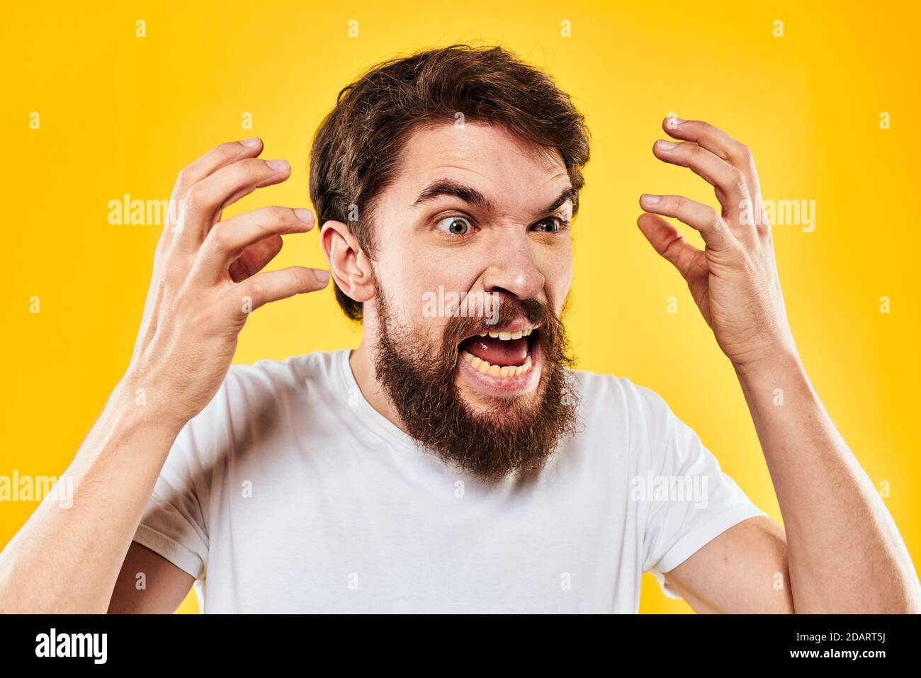 emotional bearded man gesturing with hands aggression discontent close ...