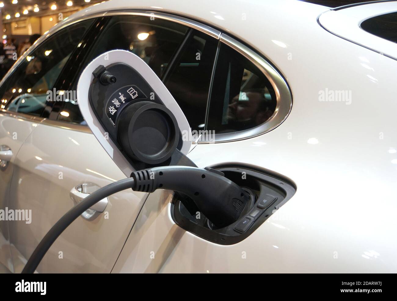 Philadelphia, Pennsylvania, U.S.A - February 10, 2019 - Electric charging port of a white 2020 Porsche Panamera Turbo Hybrid car Stock Photo