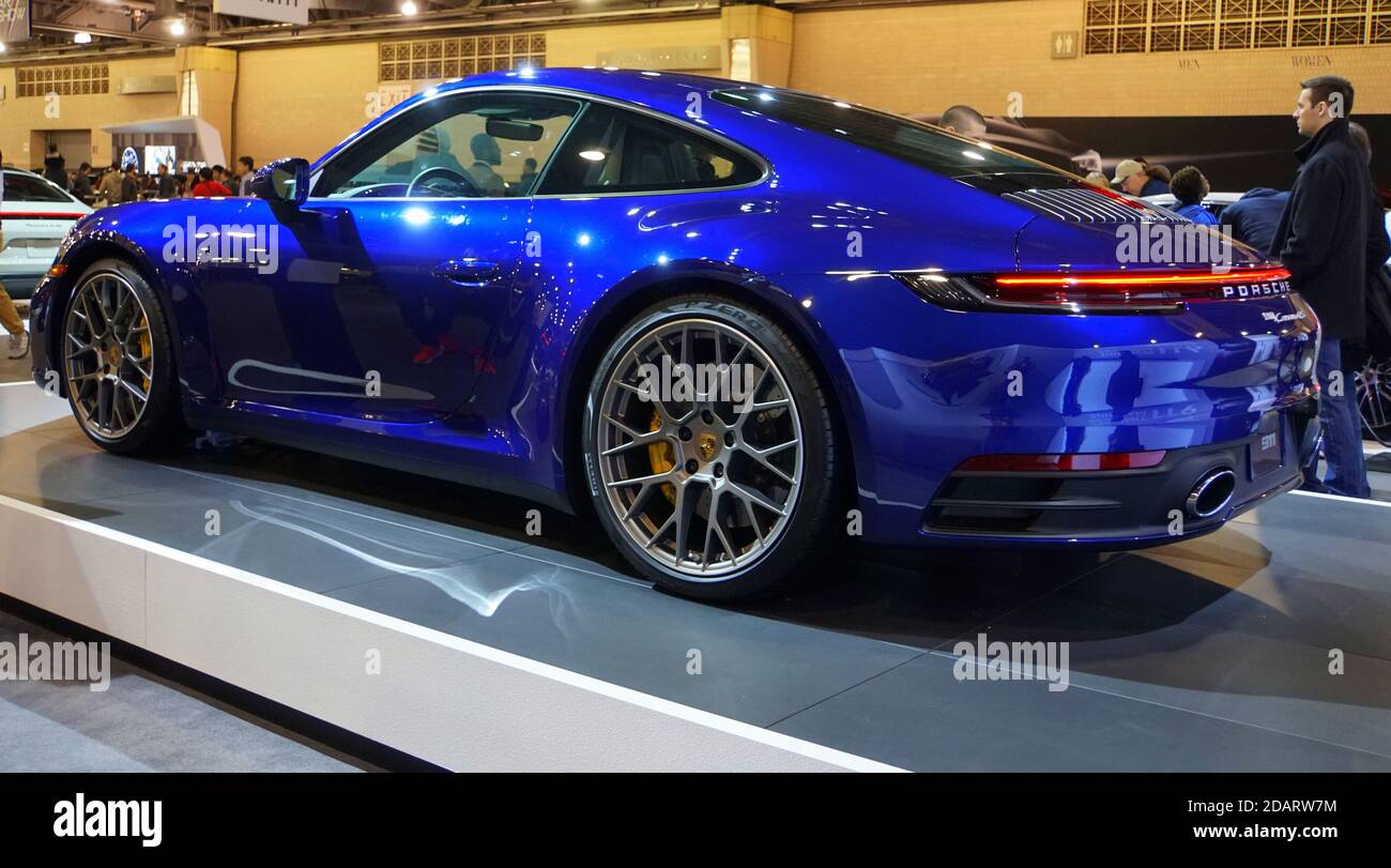 Philadelphia, Pennsylvania, U.S.A - February 9, 2019 - A side view of a blue 2019 Porsche Carrera 4S sports car Stock Photo