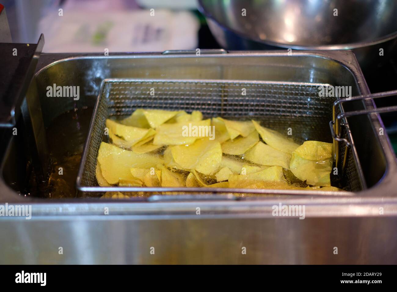 Fried potato chip in oil hot pot Stock Photo Alamy
