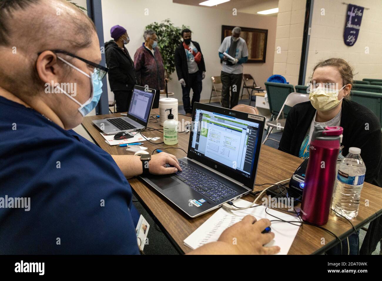 Jen Finch 40 Of Holland Ohio Takes Information From A Health Worker Standing In For A Patient At The Nha Pop Up Covid 19 Testing Location In The Greater Grace Christian Church Neighbourhood Health