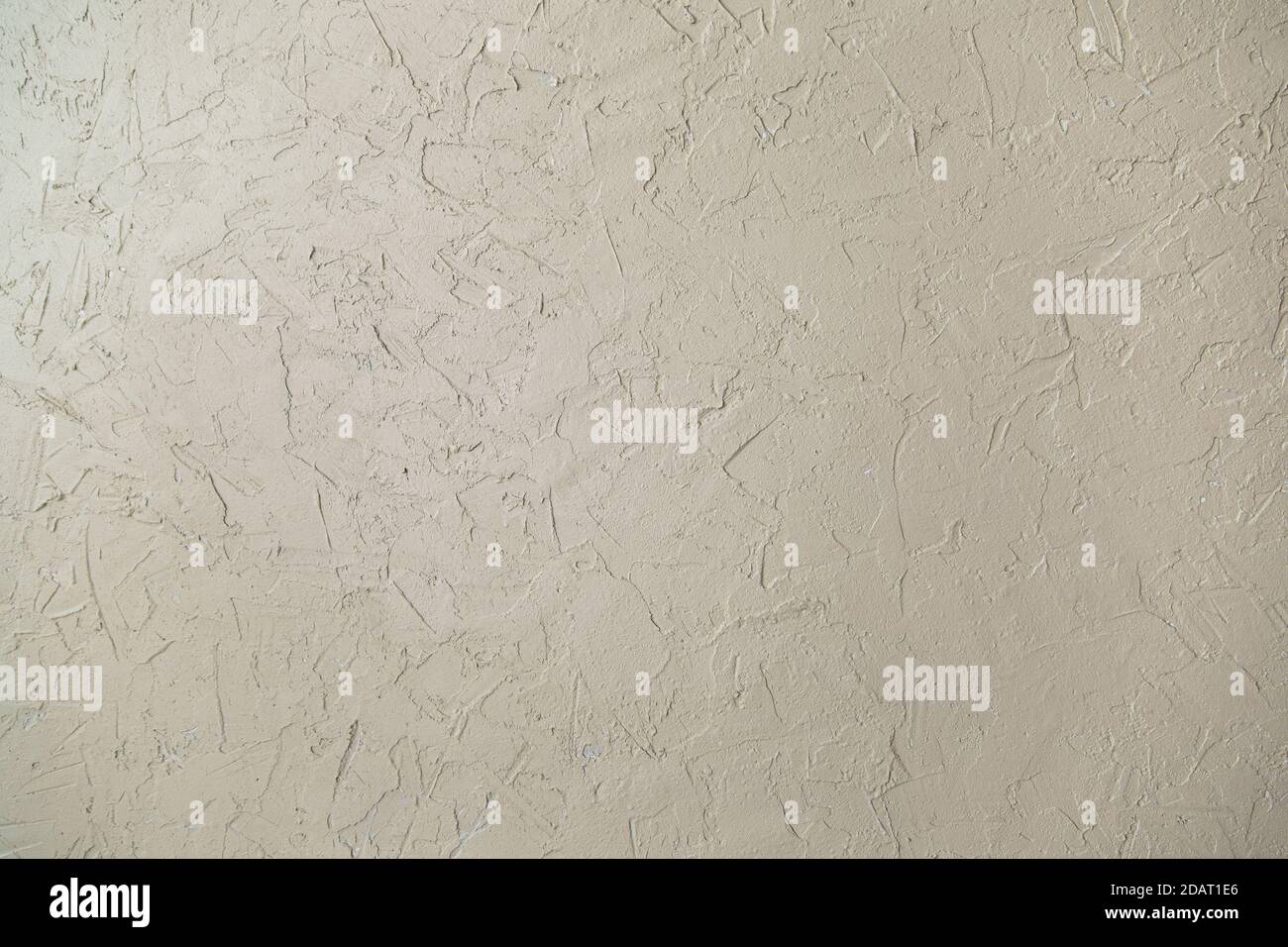The wall is decorated with decorative plaster for concrete, plaster. Light in color. Stock Photo
