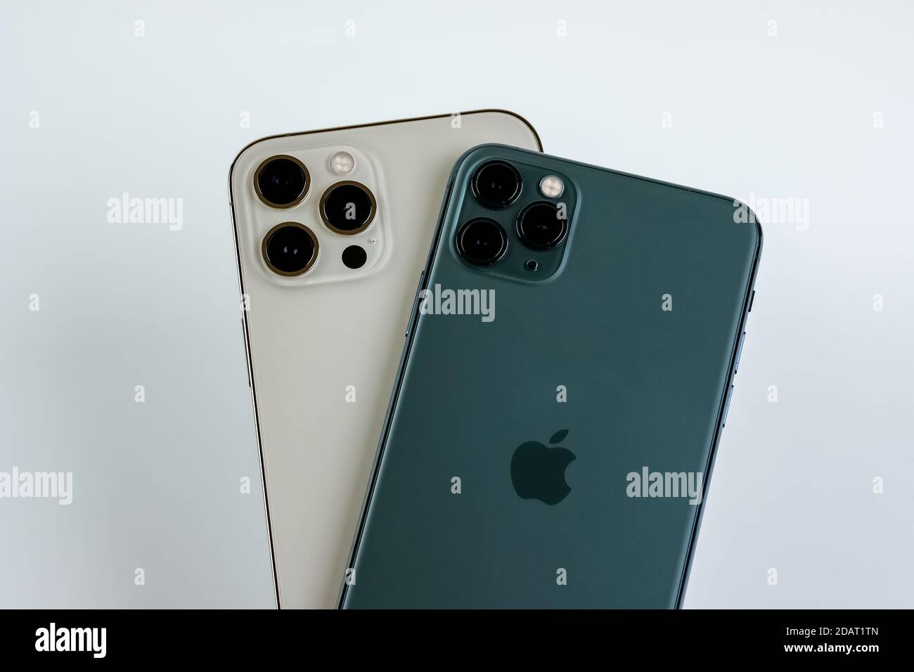 Phone 12 Pro Max In Gold Next To Iphone 11 Pro Max In Midnight Green Color Stock Photo Alamy