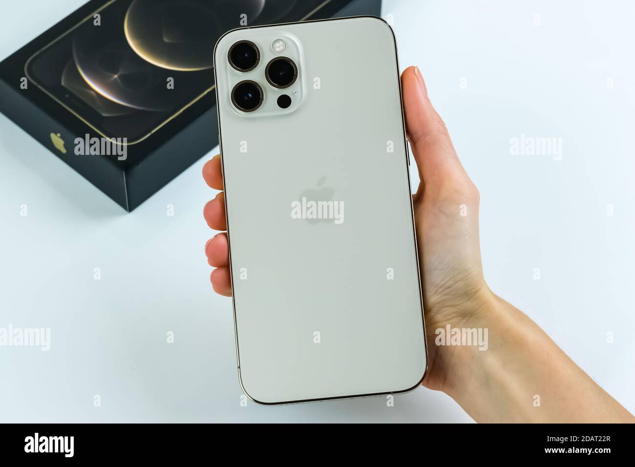 Iphone 12 Pro Max In The Gold Color In The Hand Of A Customer Stock Photo Alamy