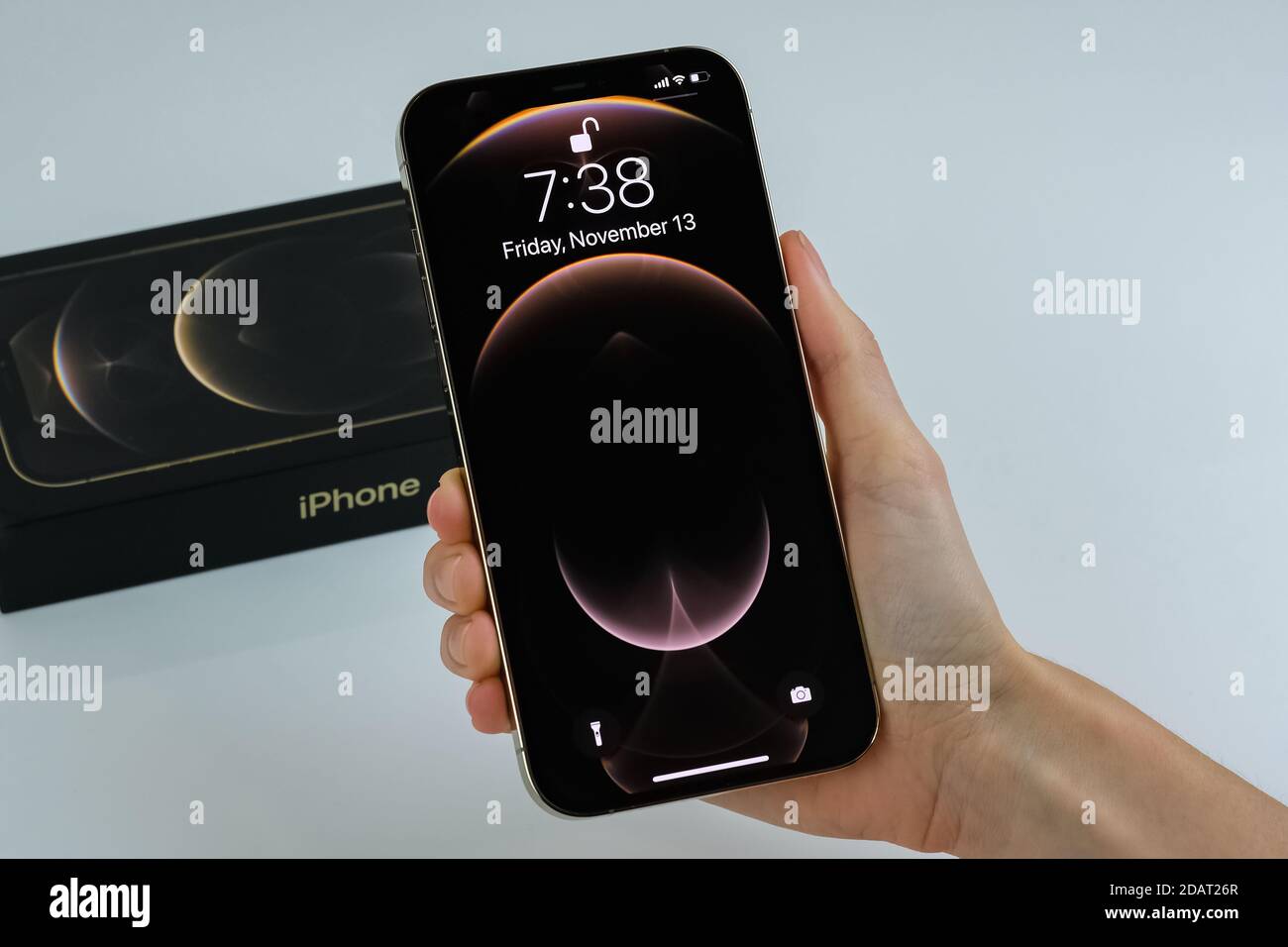 Iphone 12 Pro Max In Gold Next To Its Box Stock Photo Alamy