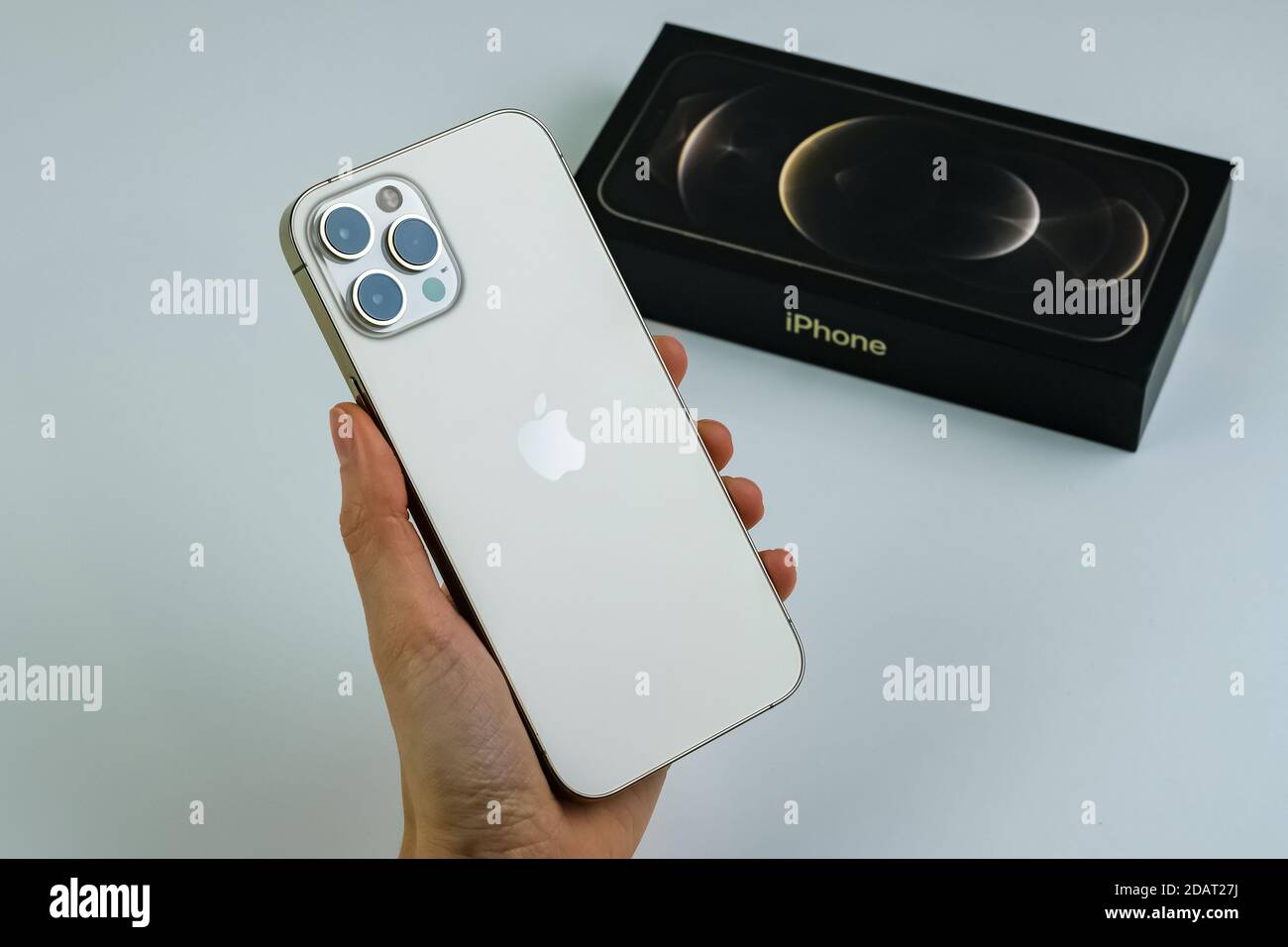 Iphone 12 Pro Max In The Gold Color In The Hand Of A Customer Stock Photo Alamy