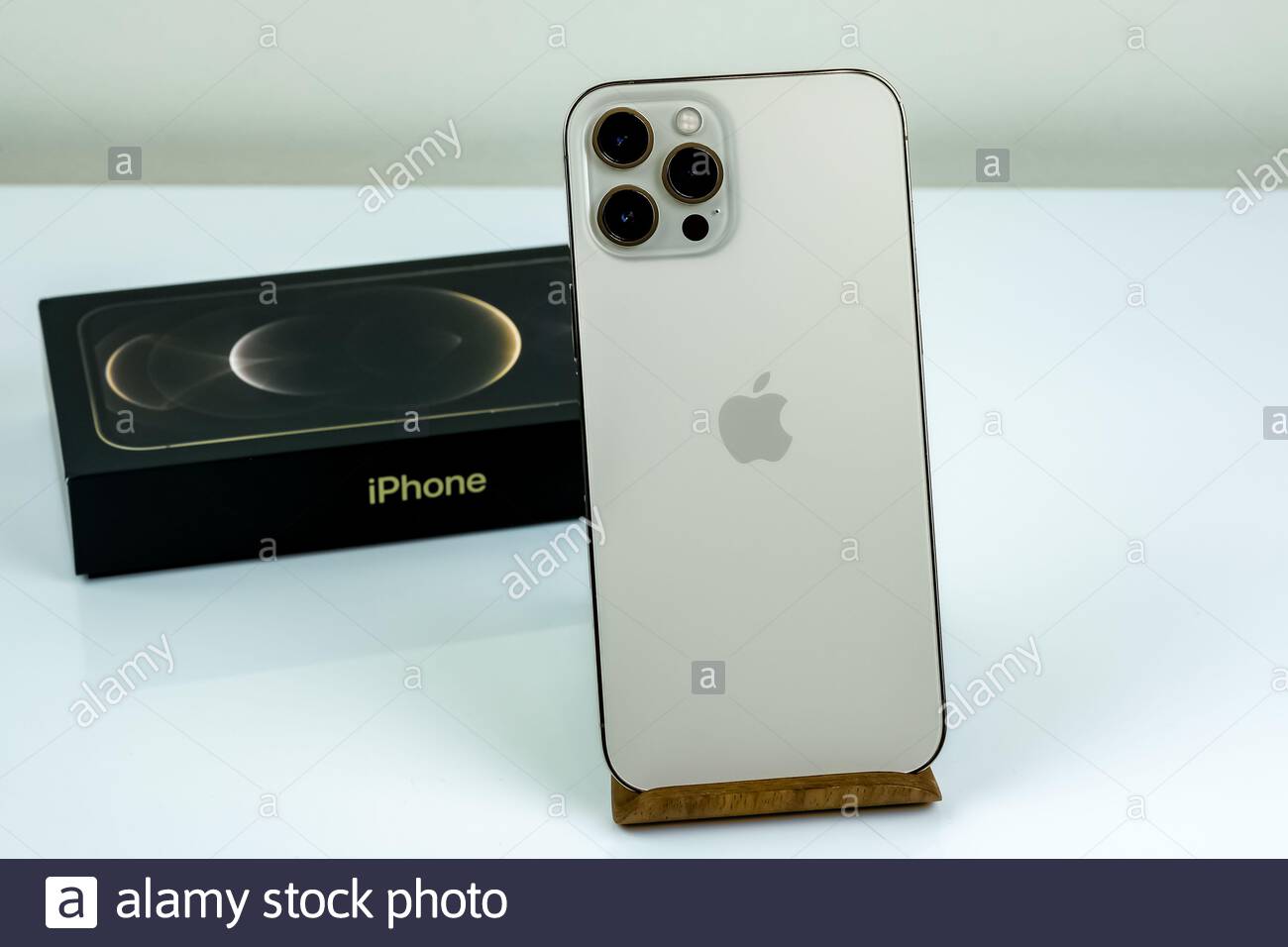 Iphone 12 Pro Max In Gold Next To Its Box Stock Photo Alamy