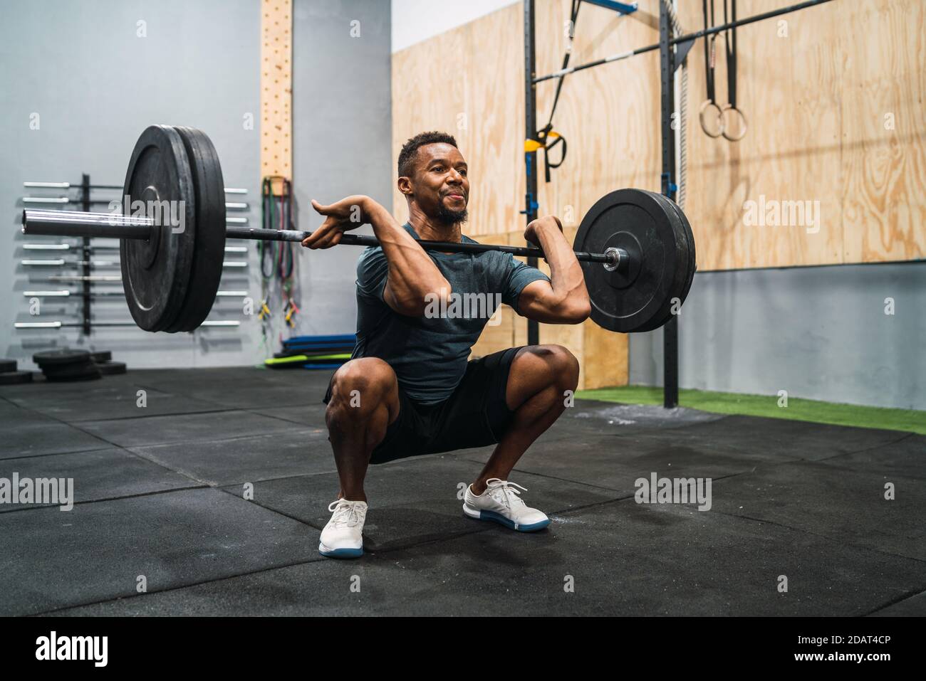 Crossfit athlete doing exercise with a barbell Stock Photo - Alamy