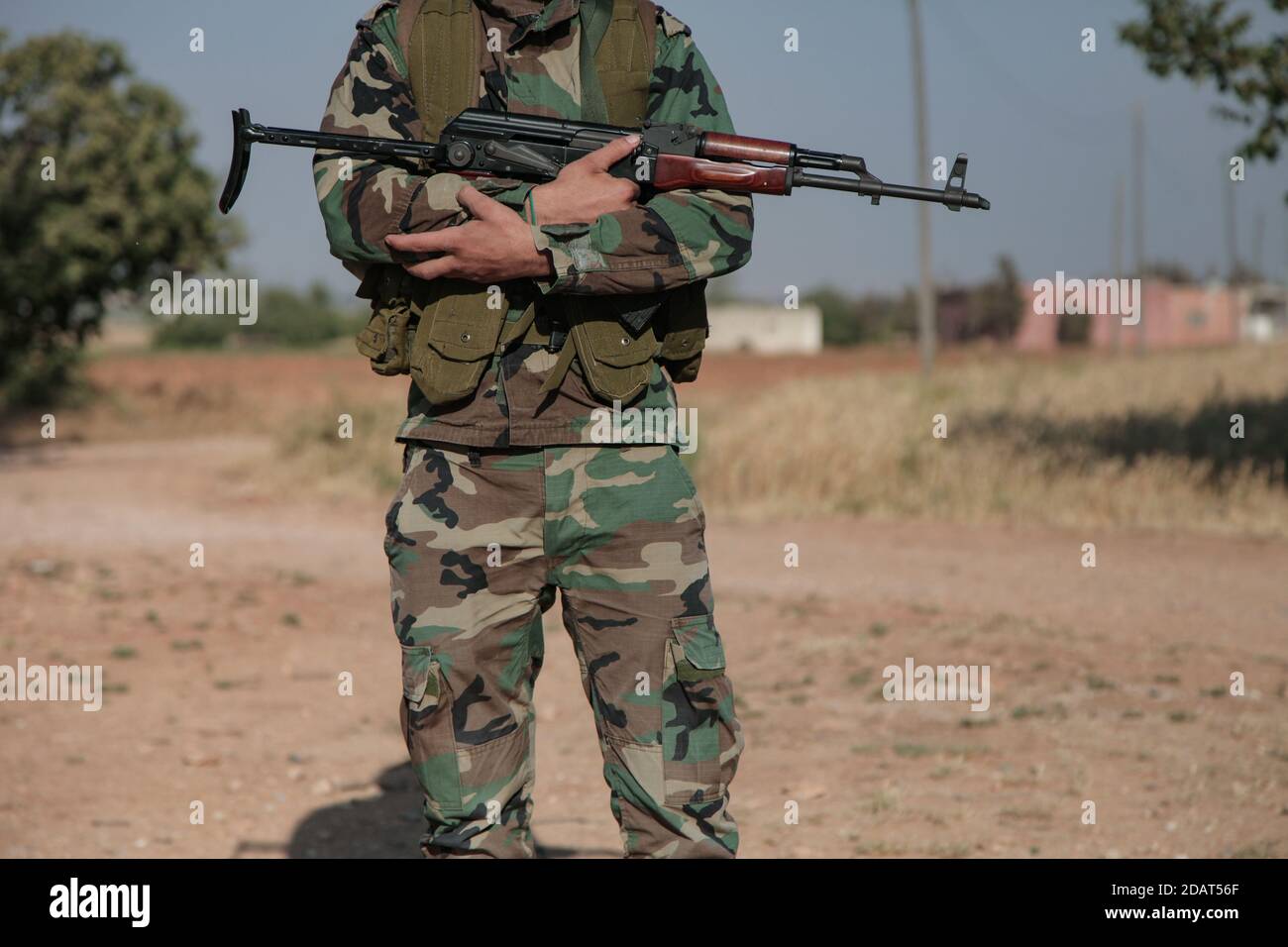 North Homs, Syria 2017: Syrian Soldier Fighter Holding AKS Russian Machine Gun during Syrian Civil War and Fight against ISIS and Al Nusra Stock Photo