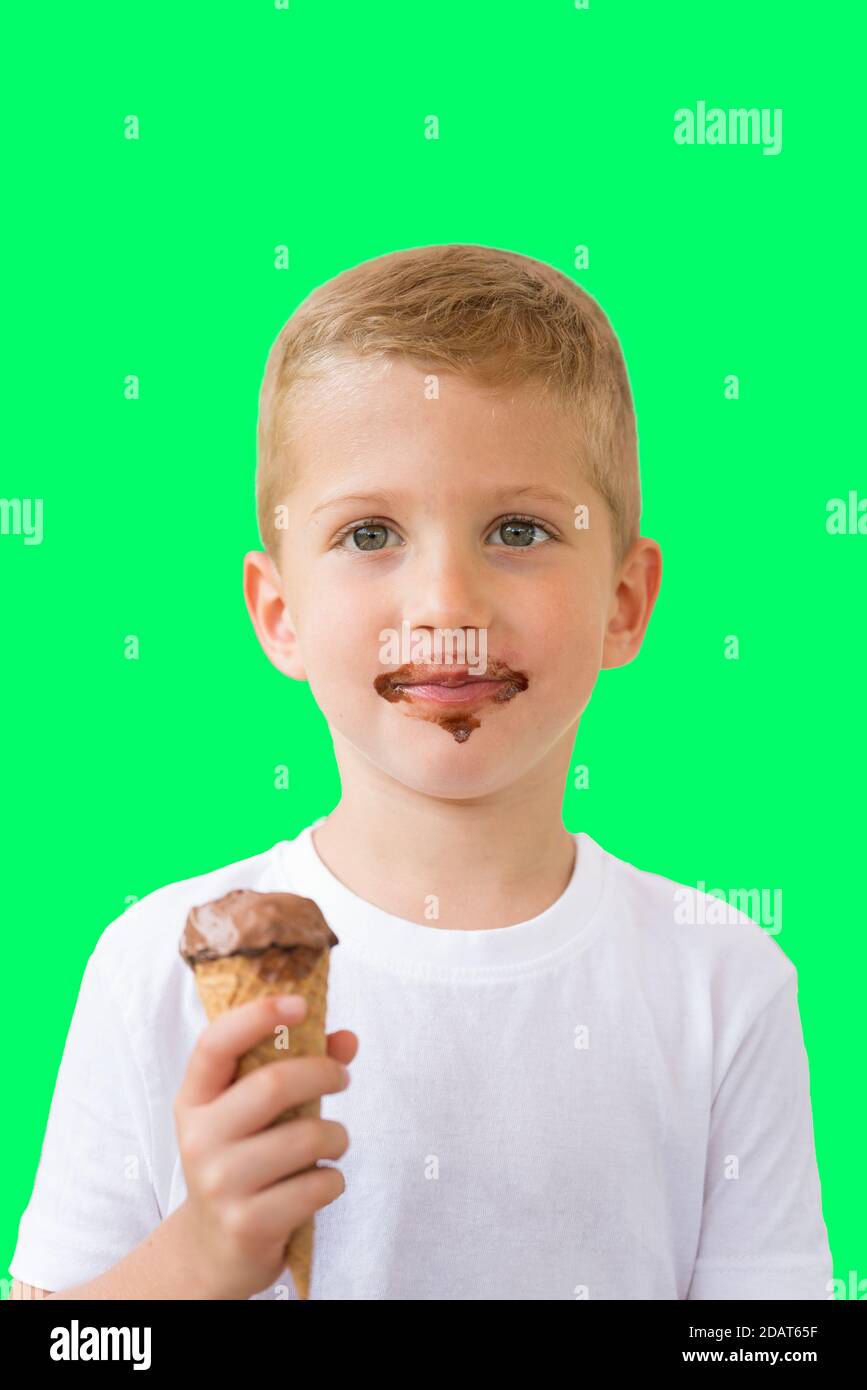 Baby boy kid hold chocolate ice cream in waffles cone isolated on green background with free