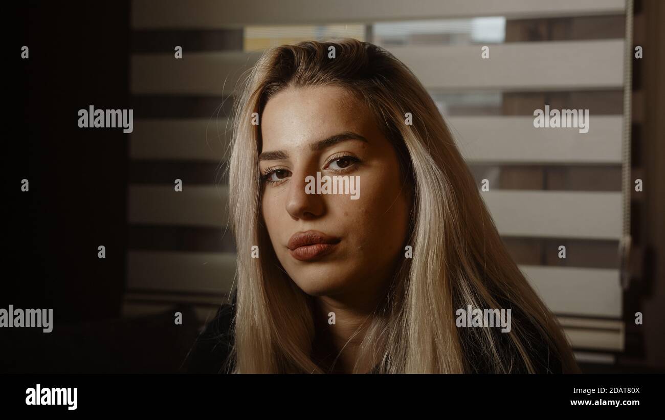 Young blonde charming attractive pretty blonde hair woman looking at camera in office or at home, dressed in blond black Stock Photo - Alamy Young blonde charming attractive pretty blonde hair woman looking at camera in office or at home, dressed in blond black Stock Photo - Alamy